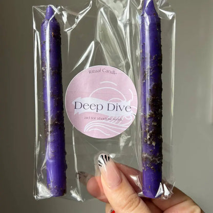 Purple spiral Deep Dive candle in clear packaging for Shadow Work rituals