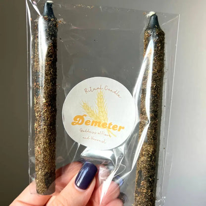 Gold and black Demeter Goddess Ritual Candle Set in clear packaging