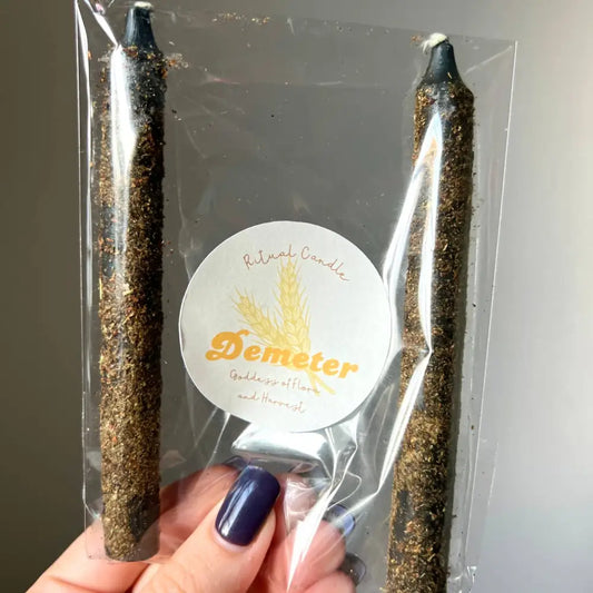 Gold and black Demeter Goddess Ritual Candle Set in clear packaging