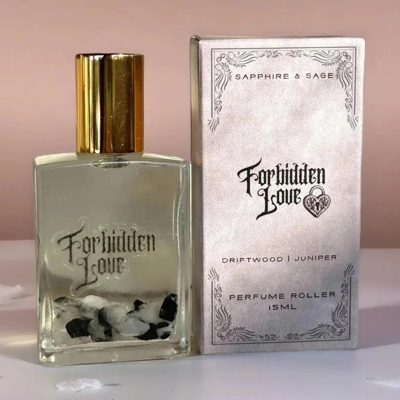 Forbidden Love crystal-infused perfume roller, driftwood and juniper scent, 15ml glass rollerball with gemstone chips