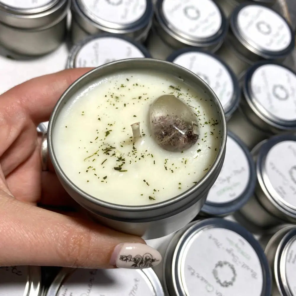 Basil and garden quartz stone candle in 4oz white tin with black speckles