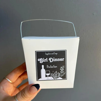 White bucket with Girl Dinner Protection label in crystal box