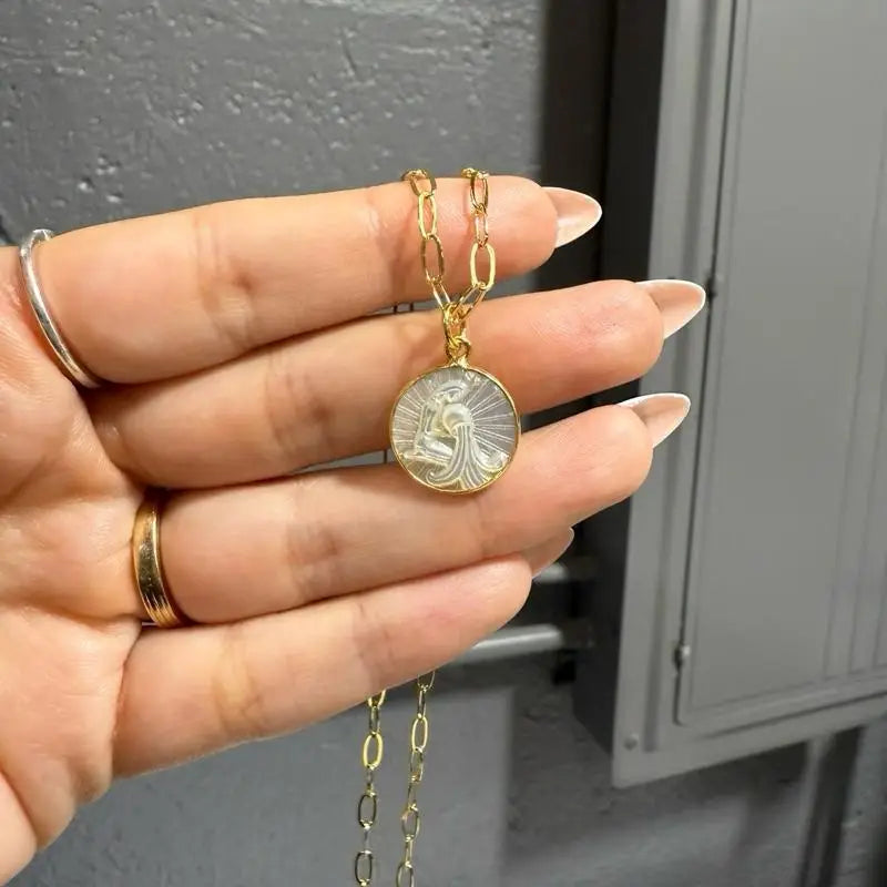 15mm gold zodiac pendant necklace with intricate coin design and adjustable chain