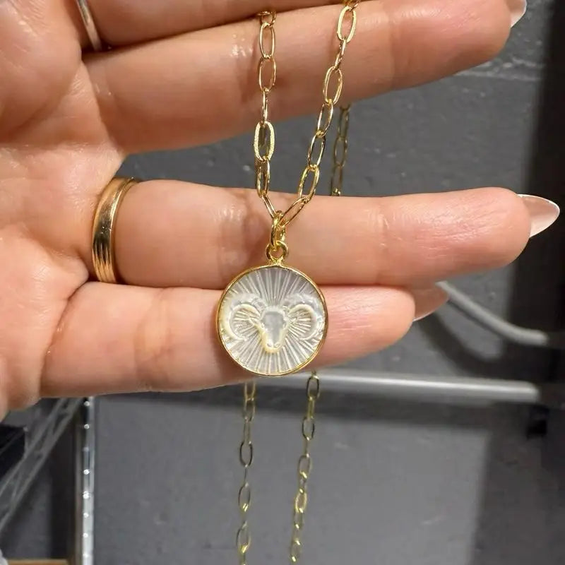 Mother of pearl zodiac sign pendant necklace on gold chain