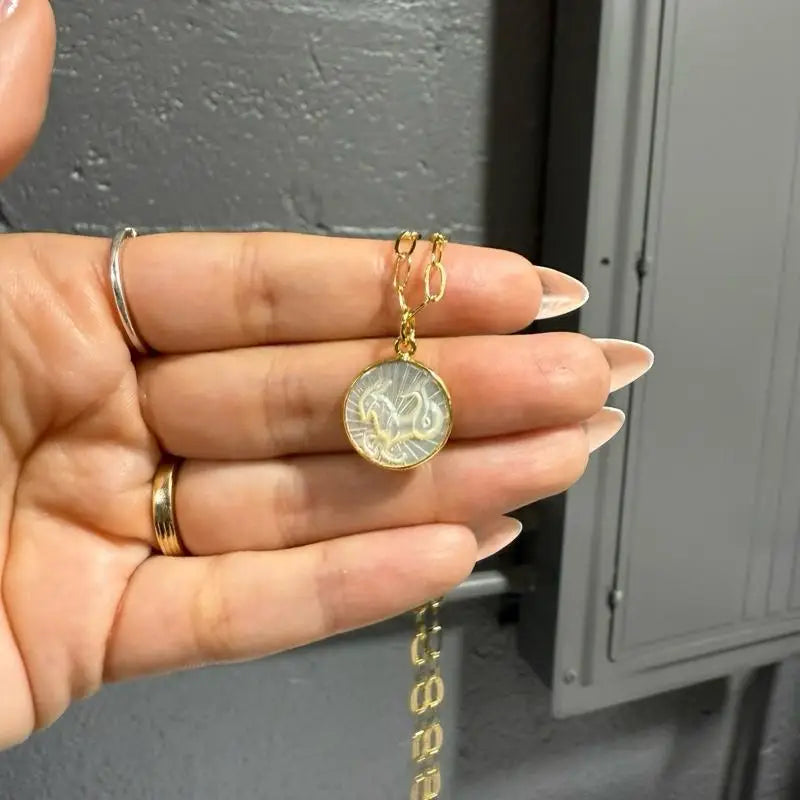 Gold coin necklace with white horse zodiac design, 15mm pendant