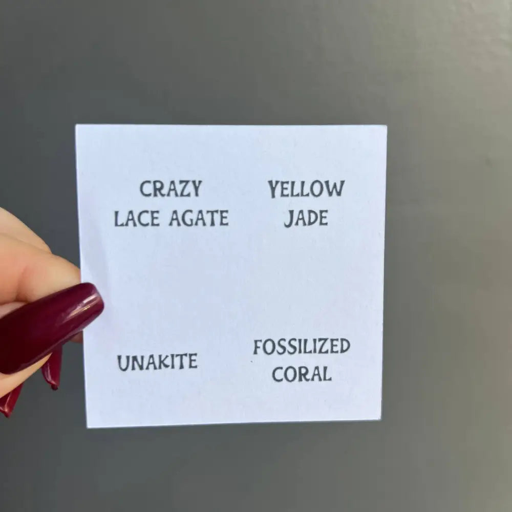 White card listing gemstone names and descriptions in Small Tumbled Stone Collection