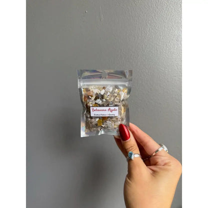 Clear plastic bag of premium crystal chip stones with white gold floral design