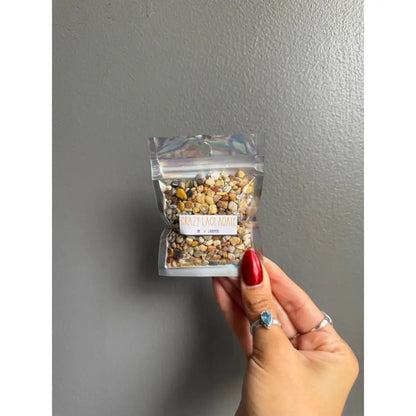 Clear plastic bag of colorful Premium Crystal Chip Stones with white label