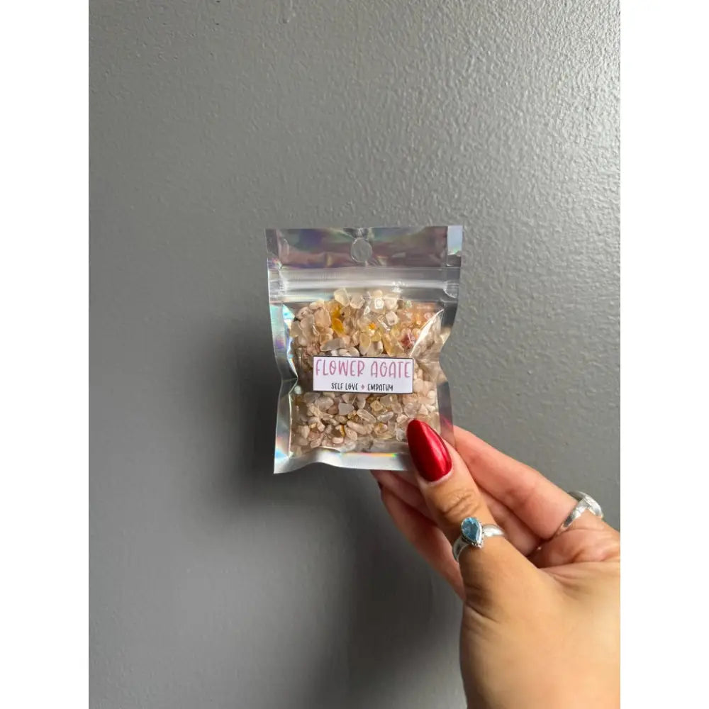 Premium flower agate chip stones in bag with red polish and silver ring