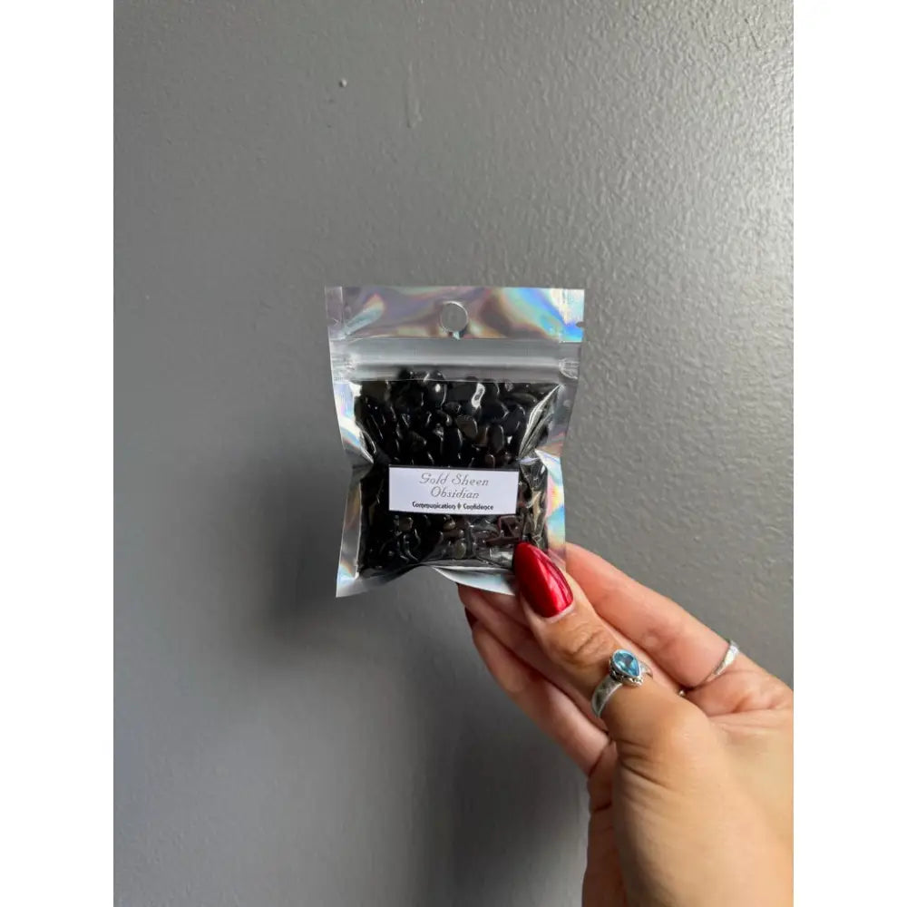 Black pearl necklace in clear bag with holographic accents for crafts