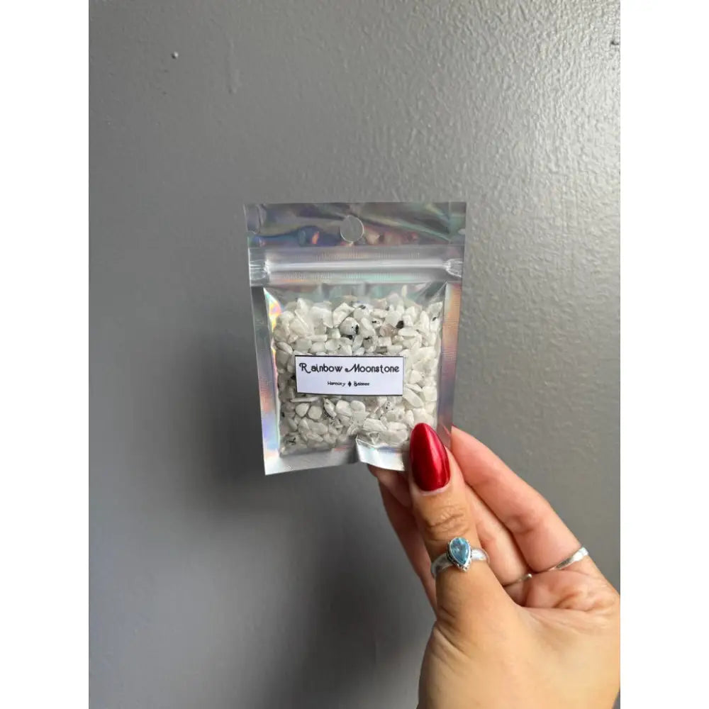 Clear plastic bag of premium white and black crystal chip stones for crafts