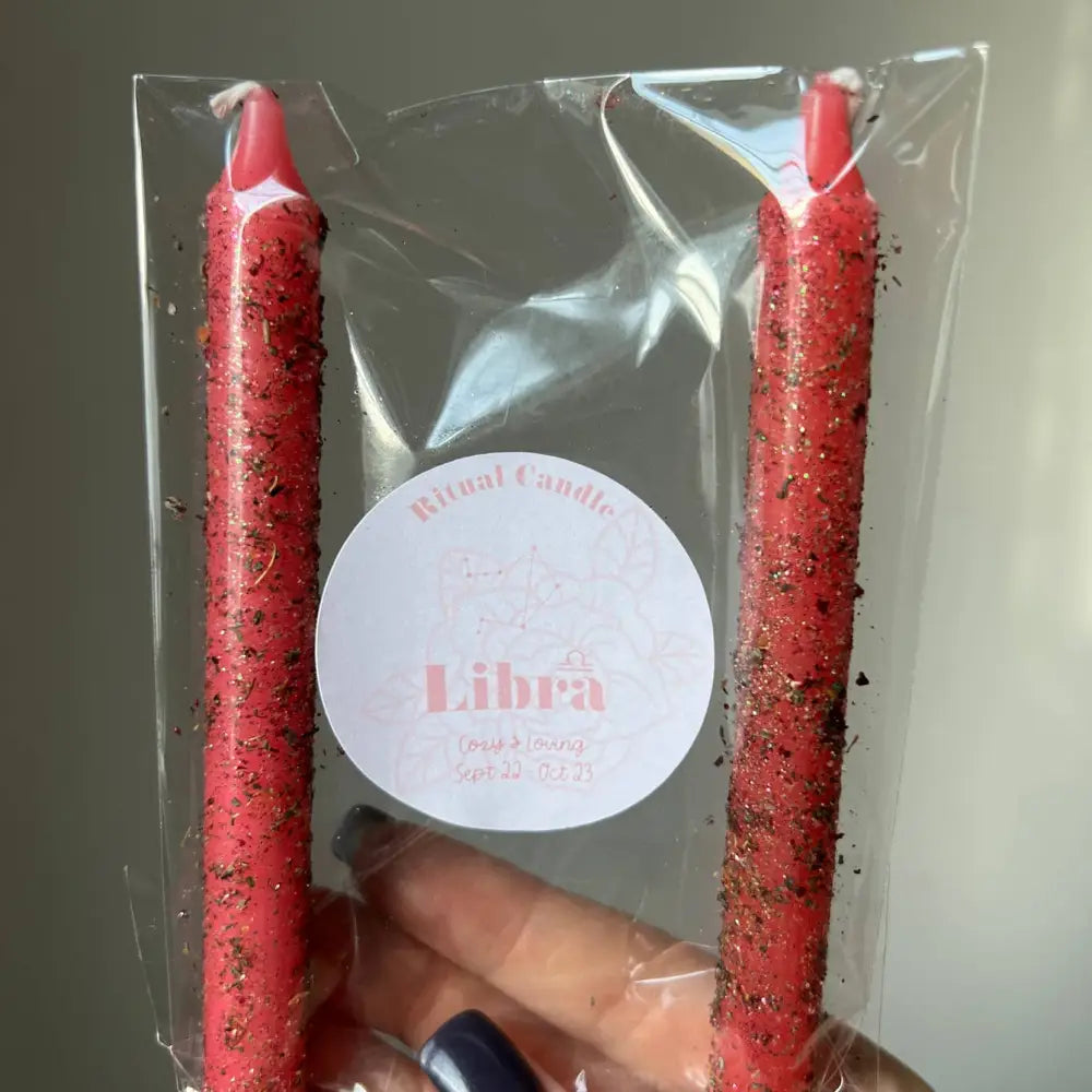 Red speckled Libra ritual candle set with herbs, oils in clear plastic pack