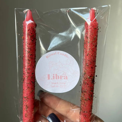 Red speckled Libra ritual candle set with herbs, oils in clear plastic pack