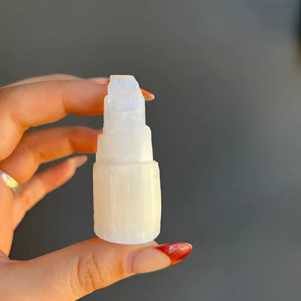 White plastic spray bottle with pump for Moroccan Selenite Tower