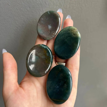 Green and gray polished stone worry pendants, 2 inches