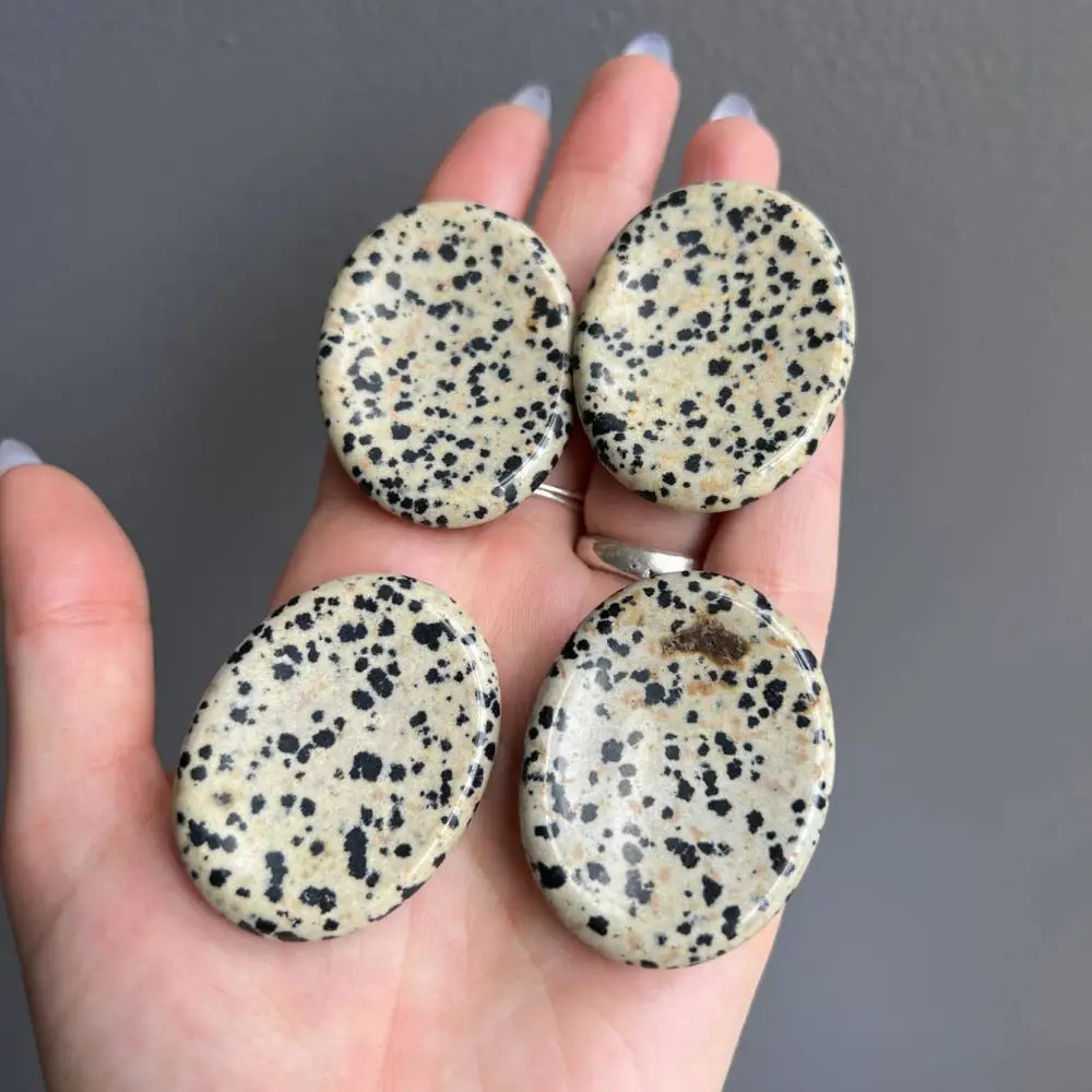 White and black speckled stone earrings with silver accents, 2 inches