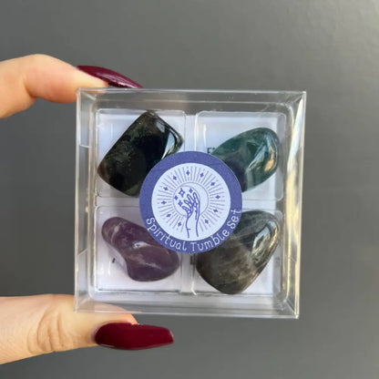 Polished intention stone set in acrylic box with purple label