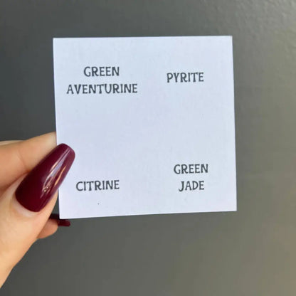 White card listing gemstone names from Natural Stone Collection for meditation display