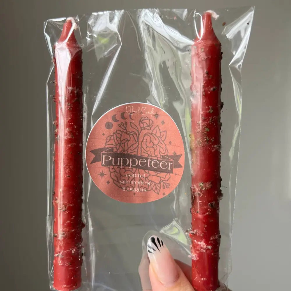 Red Puppeteer Ritual Candle in clear pack with floral label