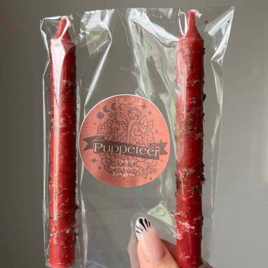 Red Puppeteer Ritual Candle in clear pack with floral label