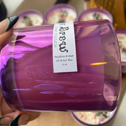 Purple 10 oz soy wax candle with white label and black text