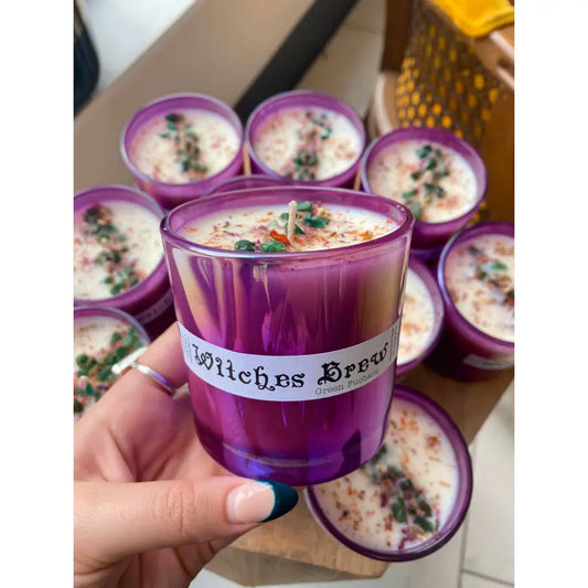 Purple witches brew 10 oz soy wax candle with herb decor