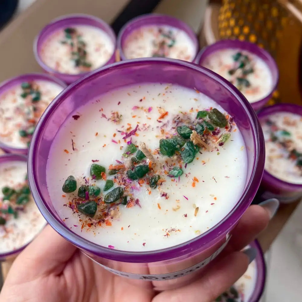 10 oz soy wax lavender candle in purple container with floral herb accents