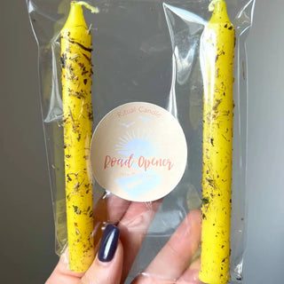 Yellow speckled Road Opener ritual candles in clear pack with herbs and oils
