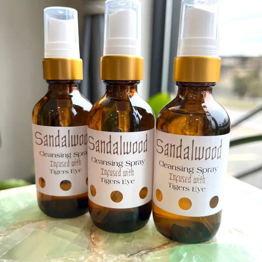 Sandalwood and Vanilla Cleansing Spray in amber bottle with gold cap and dotted label