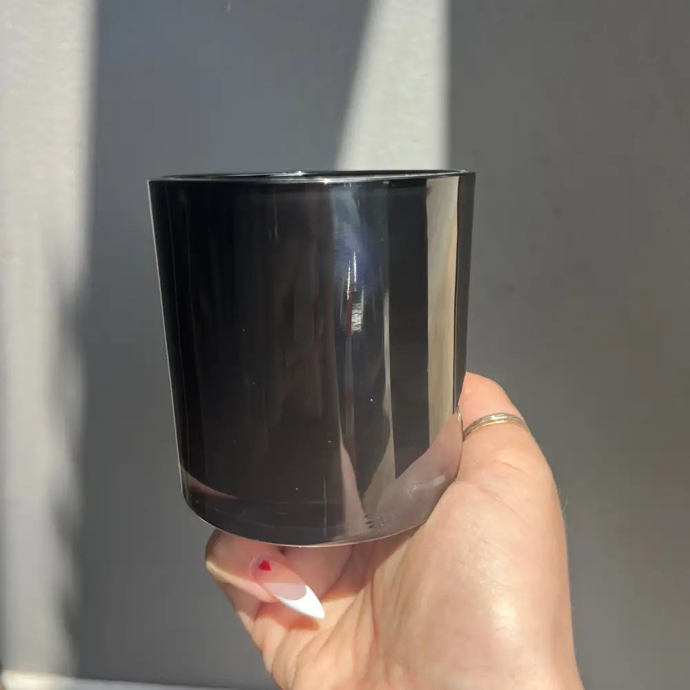 Glossy black glass tumbler with silver rim for Custom Crystal Candle Creation Guide
