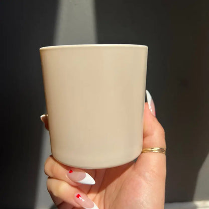 Beige matte ceramic mug with gold rim and handle