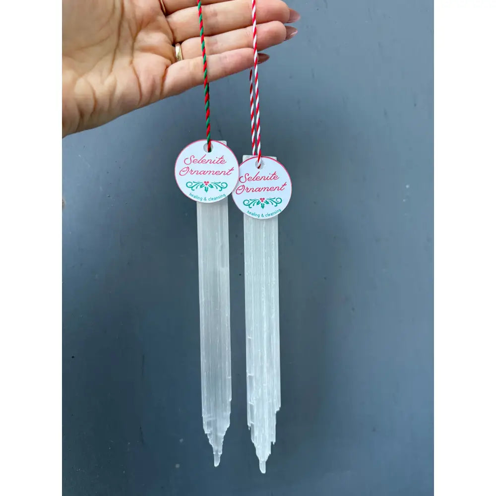 Clear selenite icicle Christmas ornaments set of 4 with red-white striped string and pink labels