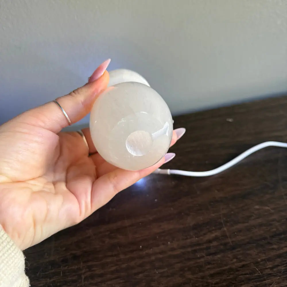 White translucent silicone egg-shaped mass in 4.5-inch Selenite Mushroom Lamp