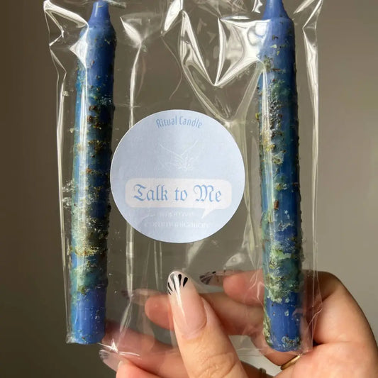 Blue speckled Talk to Me ritual candles in clear plastic pack for better communication
