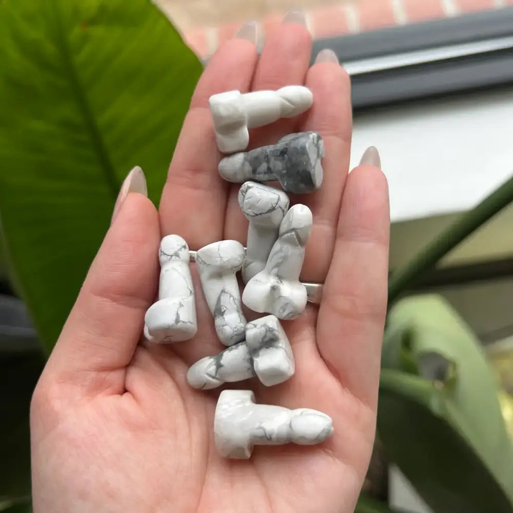 White and gray howlite beads in 1 inch natural stone phallus carving