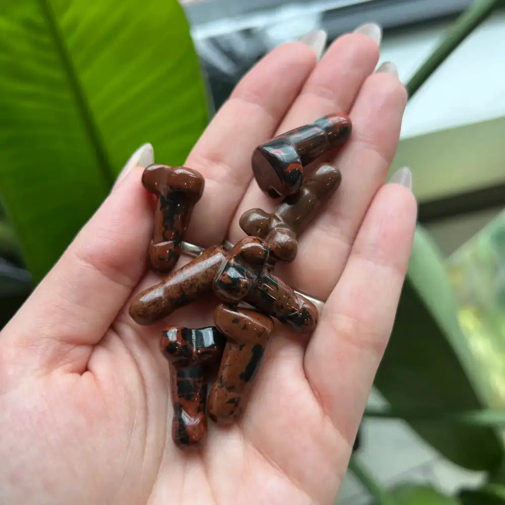 Brown and black marbled gemstone beads on 1 inch natural stone crystal phallus carving