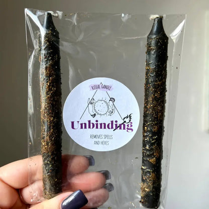Black taper candle with gold glitter in clear bag for Unbinding Ritual Set