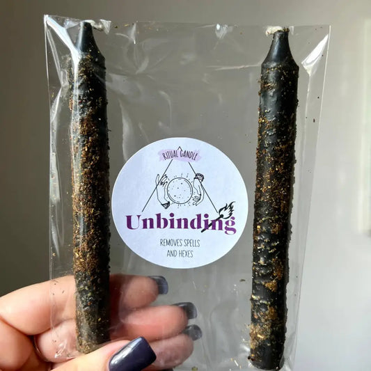 Black taper candle with gold glitter in clear bag for Unbinding Ritual Set