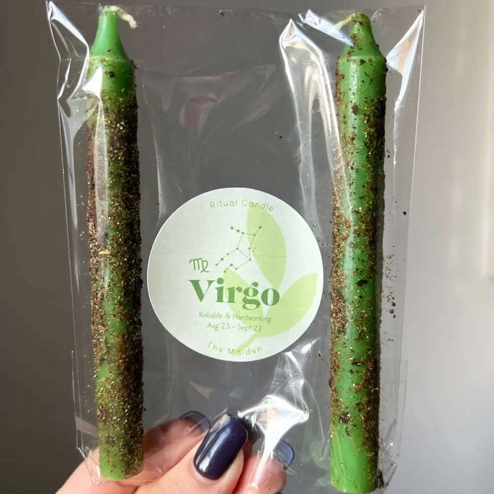 Green glittery Virgo candles in clear plastic packaging, set of two