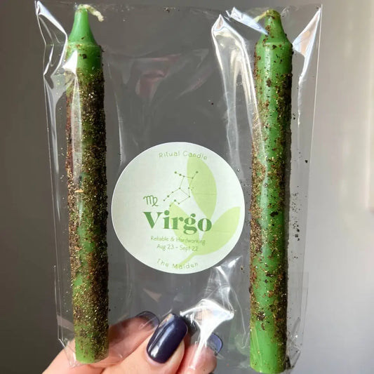 Green glittery Virgo candles in clear plastic packaging, set of two