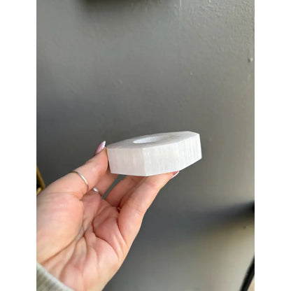 White hexagonal matte soap dispenser in octagon selenite holder