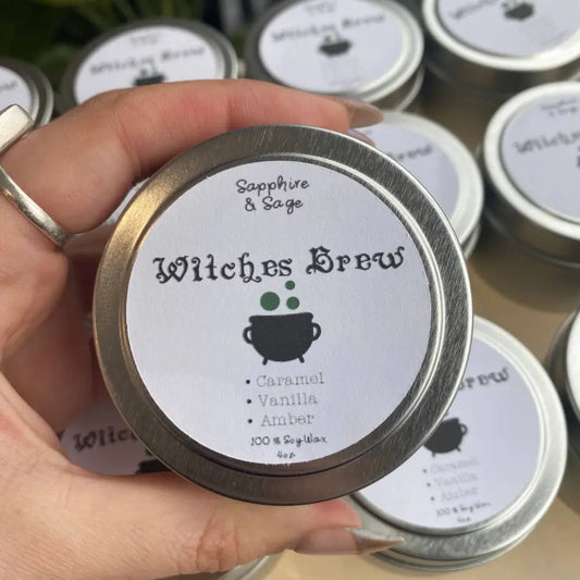 Silver tin soy candle with fuchsite crystals, witchs brew label and cauldron design