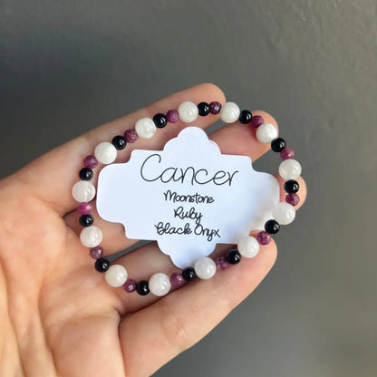 Moonstone ruby beaded bracelet with onyx accents and Cancer zodiac design