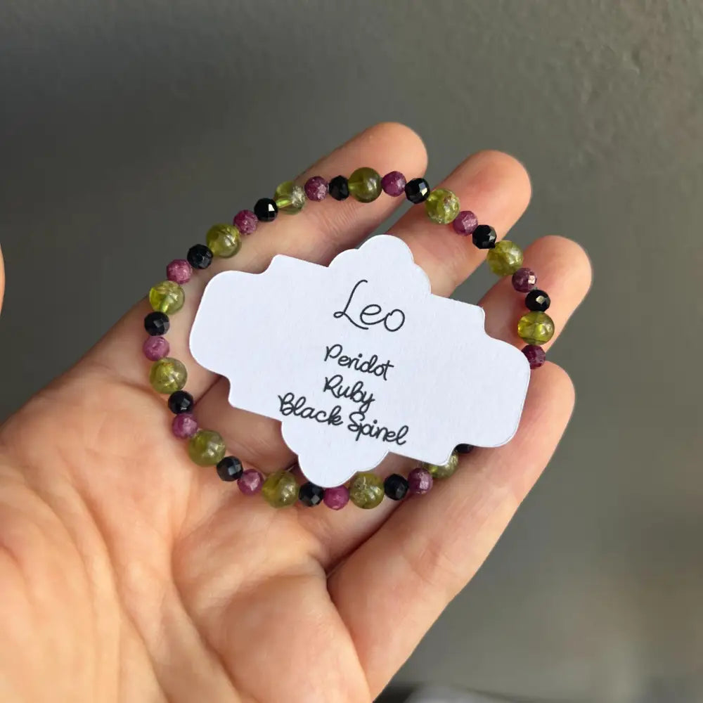 Green purple beaded Leo zodiac bracelet with black spinel gems