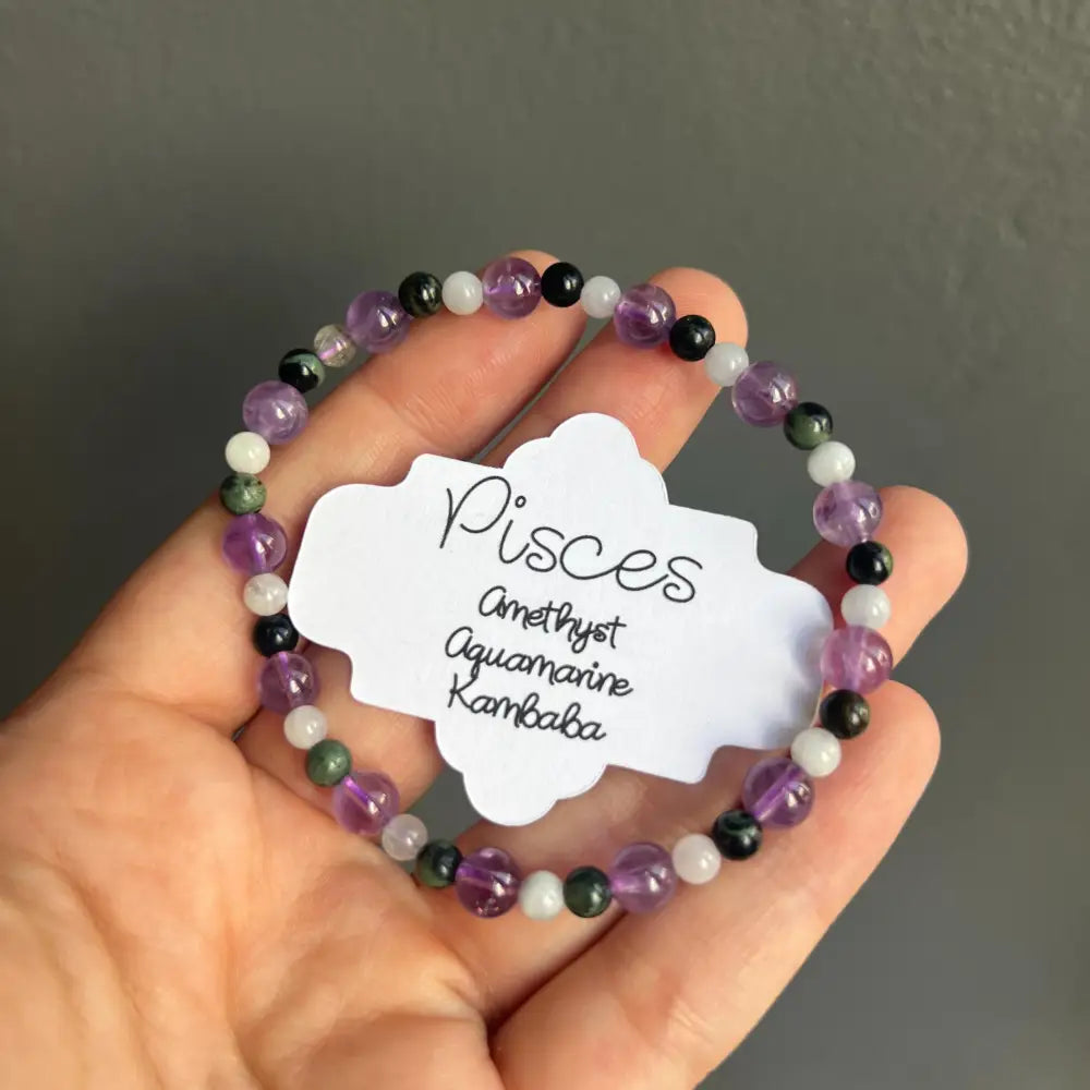 Zodiac crystal bracelet with amethyst, aquamarine, kambaba beads, black accents