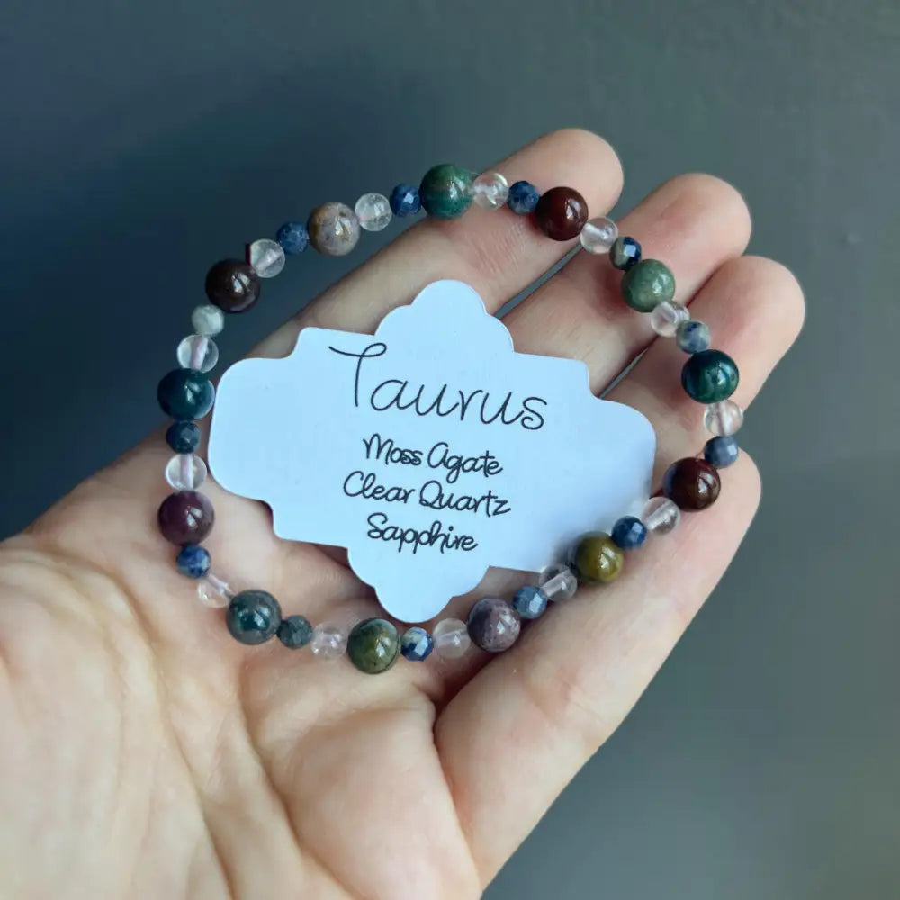 Taurus zodiac bracelet with moss agate, quartz, and sapphire beads